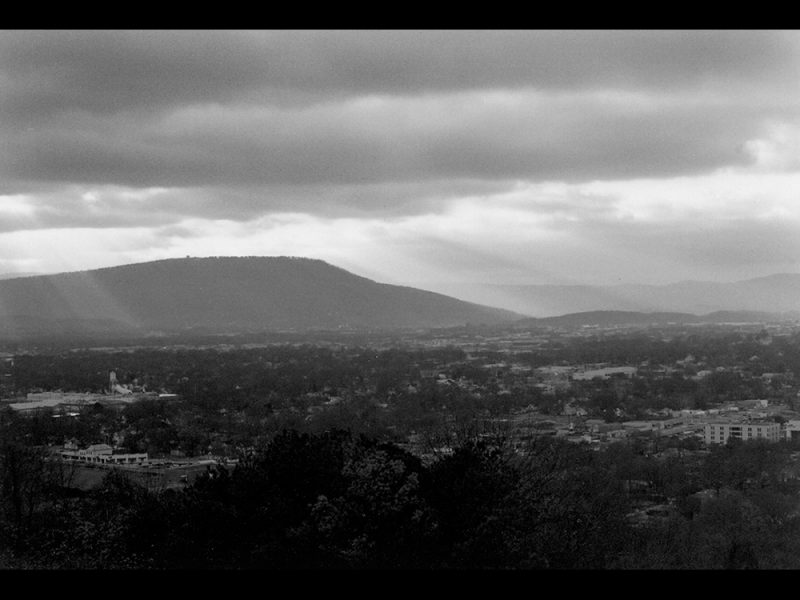 Battles for Chattanooga: [1996] Lookout Mountain flooded by sunrays and looming over the city on November 25, 1996, a cloudy moody day